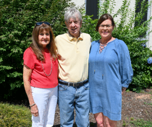 First Student Body President Buddy Ashe and family standing in front of Dallas Campus building.